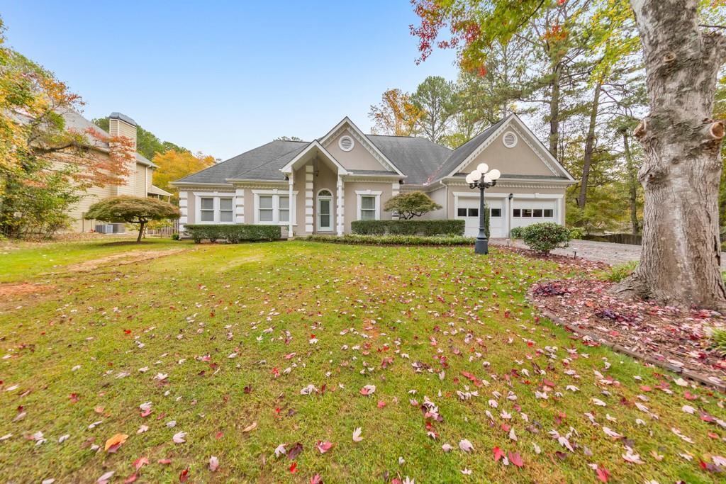 a front view of a house with a yard