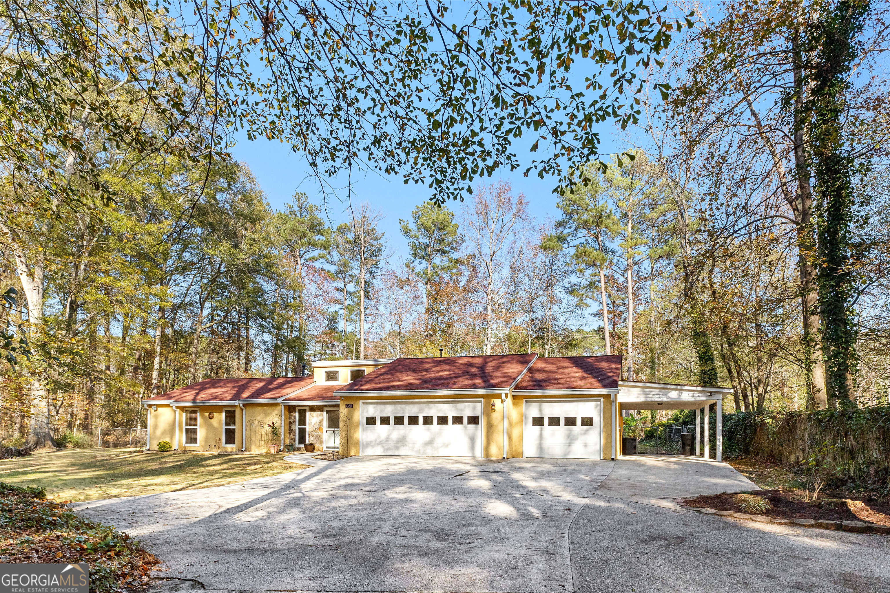 a view of a building with a tree in front