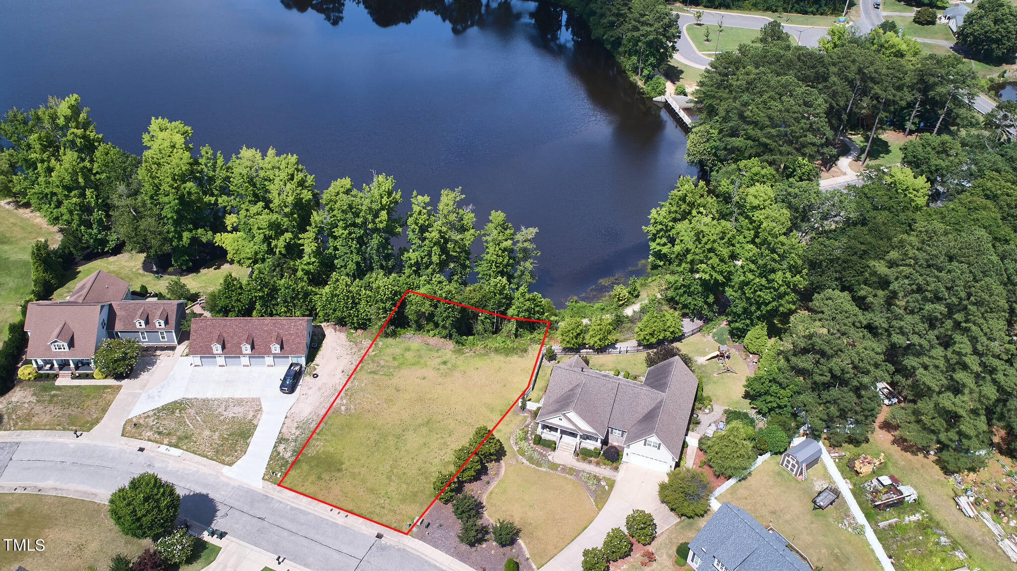 an aerial view of a house with yard