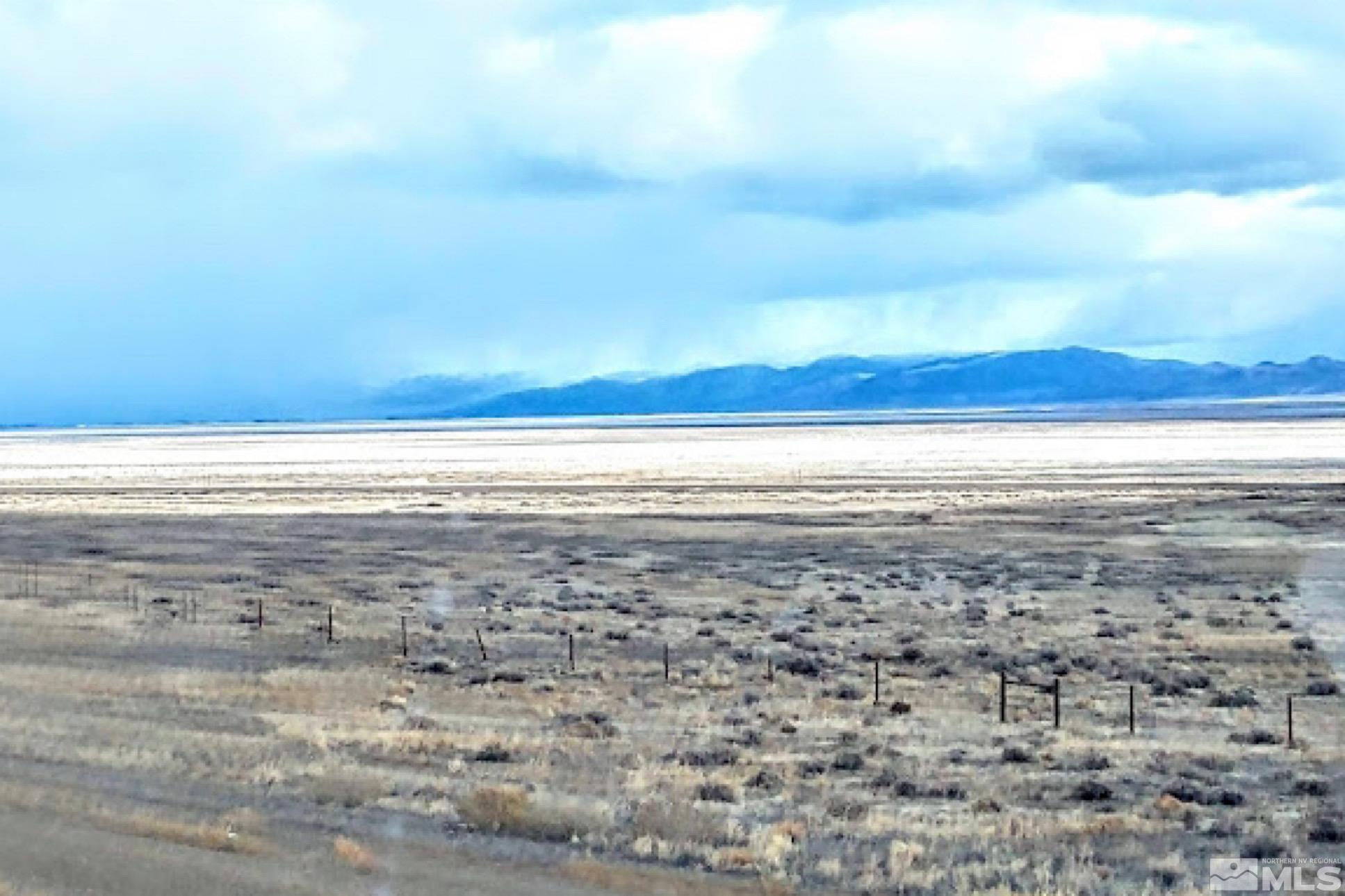 a view of an ocean beach and mountain