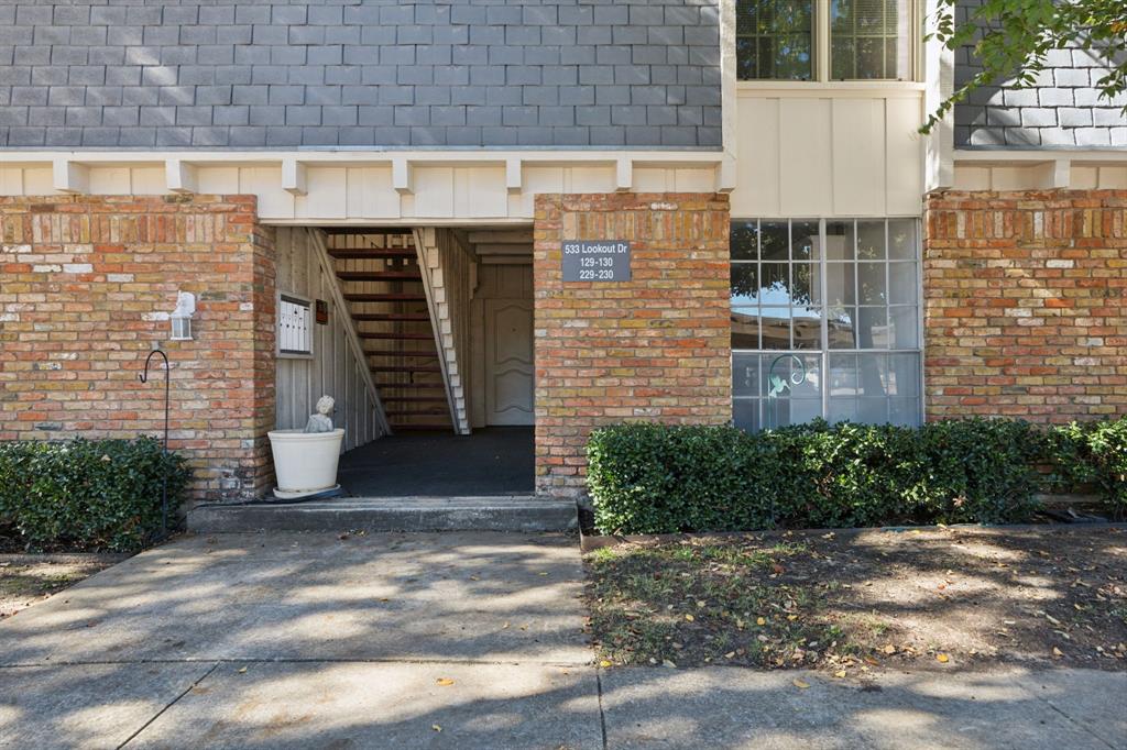 a view of a brick house with a street