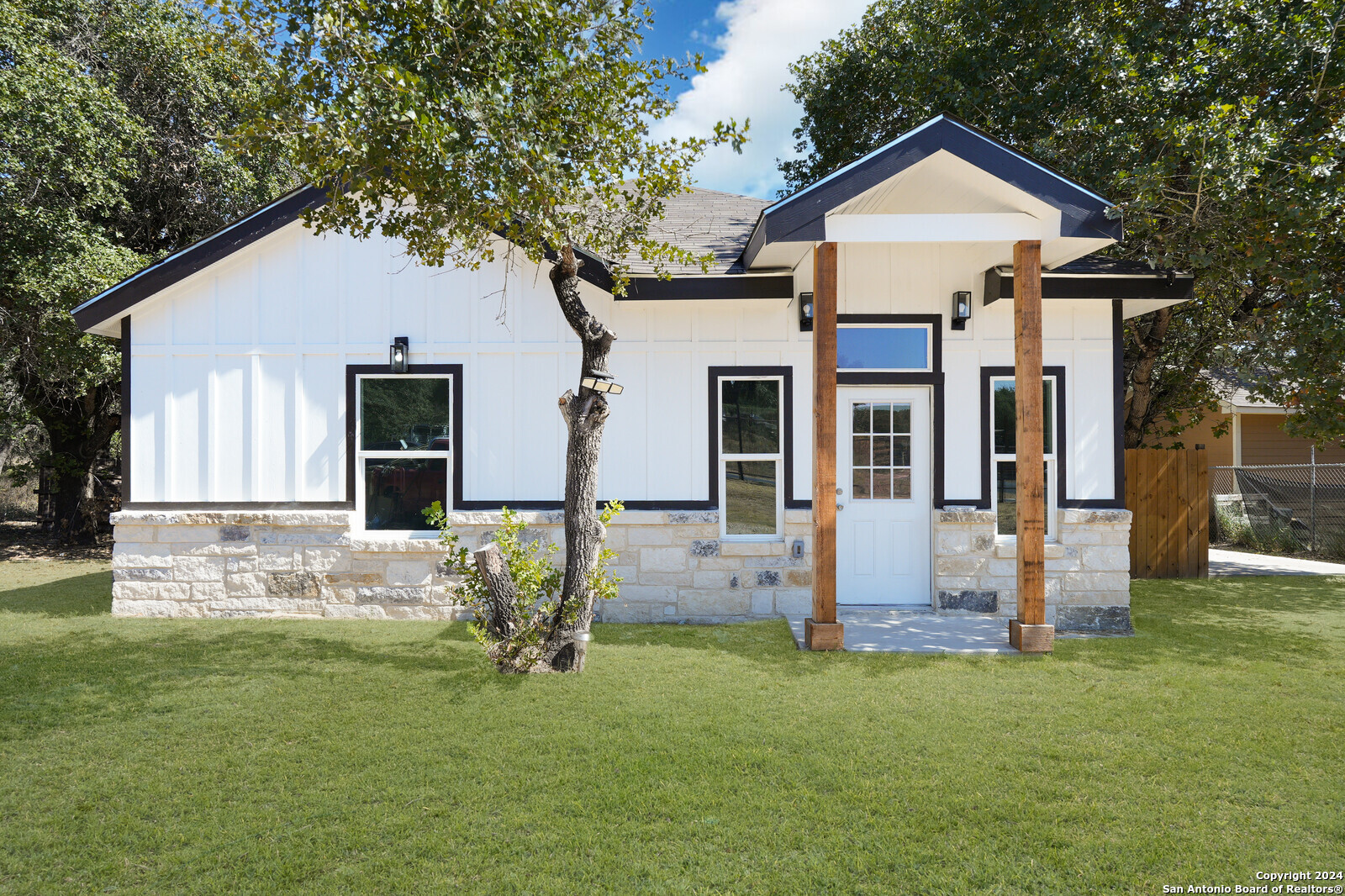 a front view of a house with garden