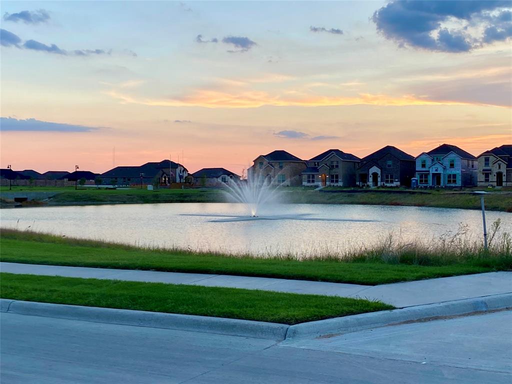 a view of a lake in front of a house