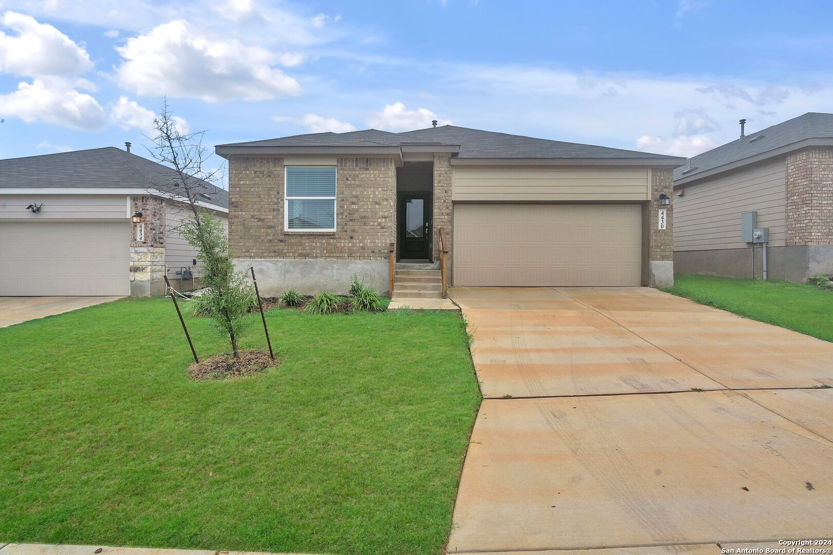 a house view with a garden space