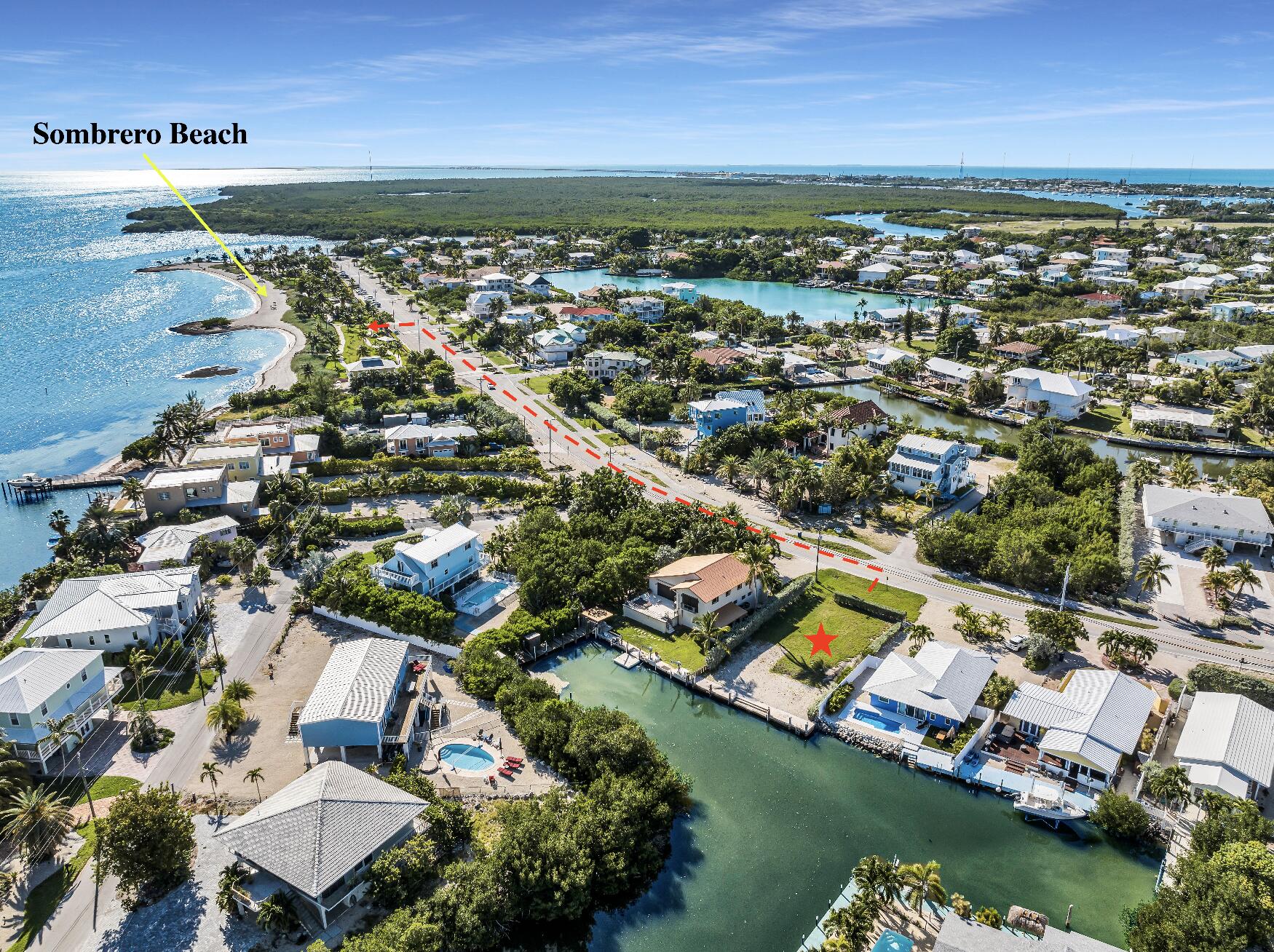 an aerial view of residential building with outdoor space and lake view