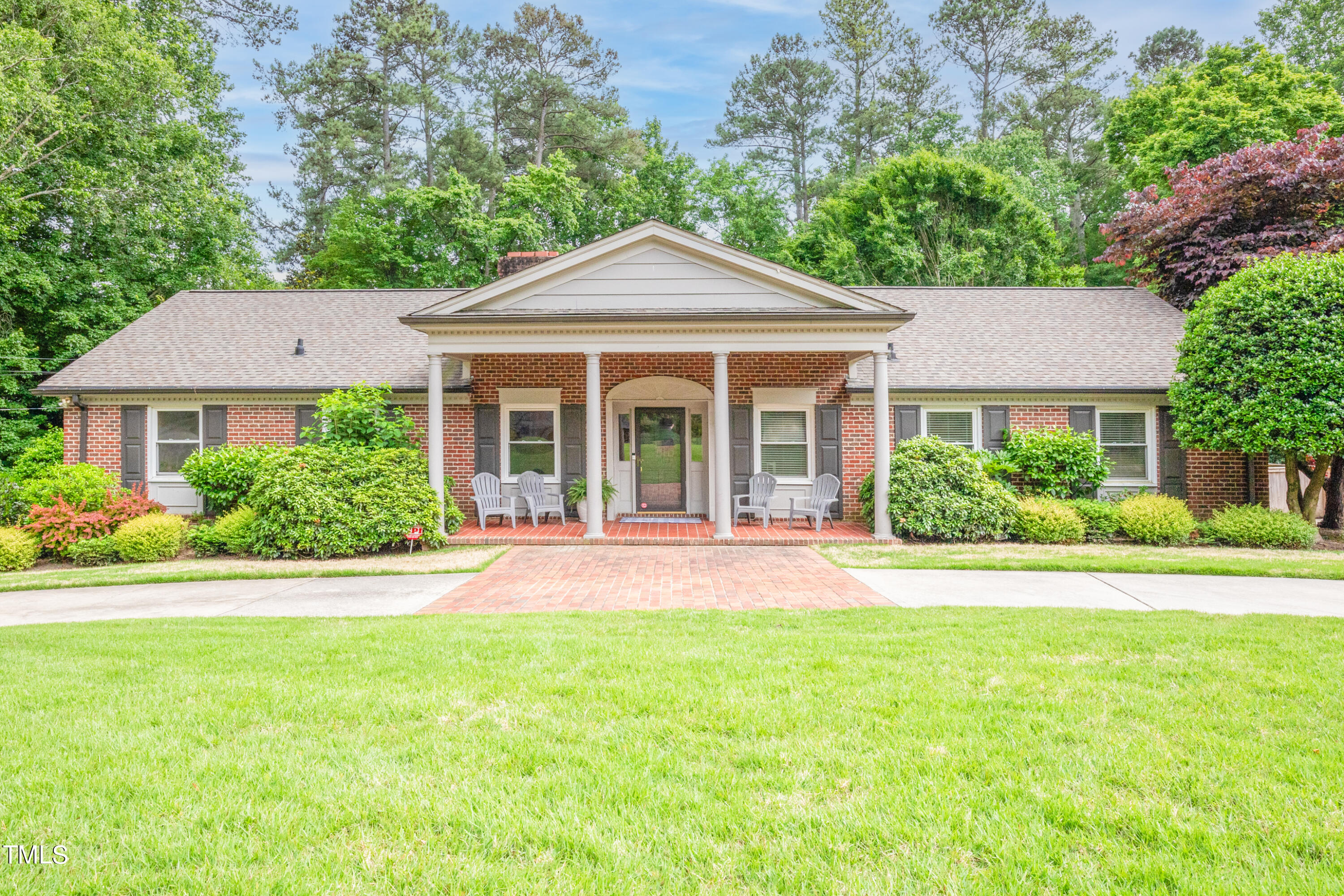 front view of a house next to a yard