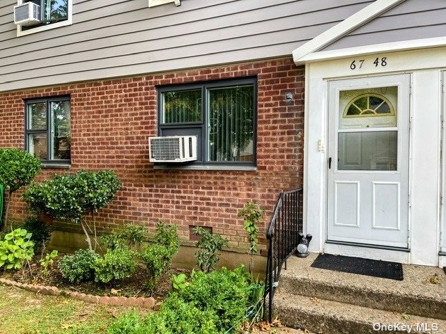 a front view of a house with a garage