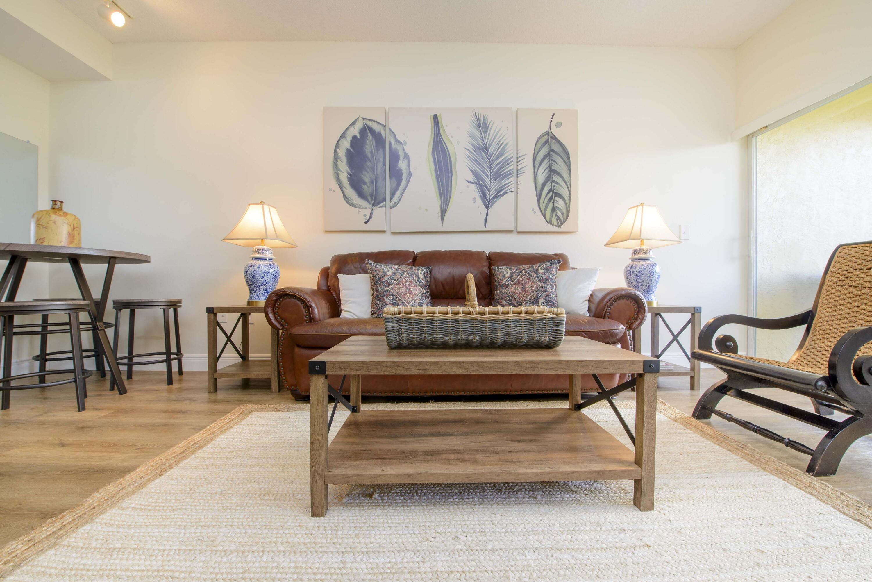 a living room with furniture and a rug