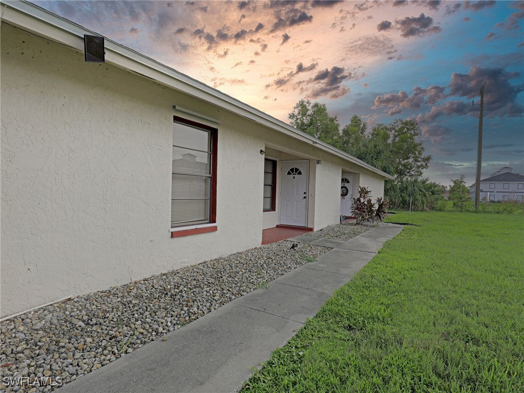 a front view of a house with garden