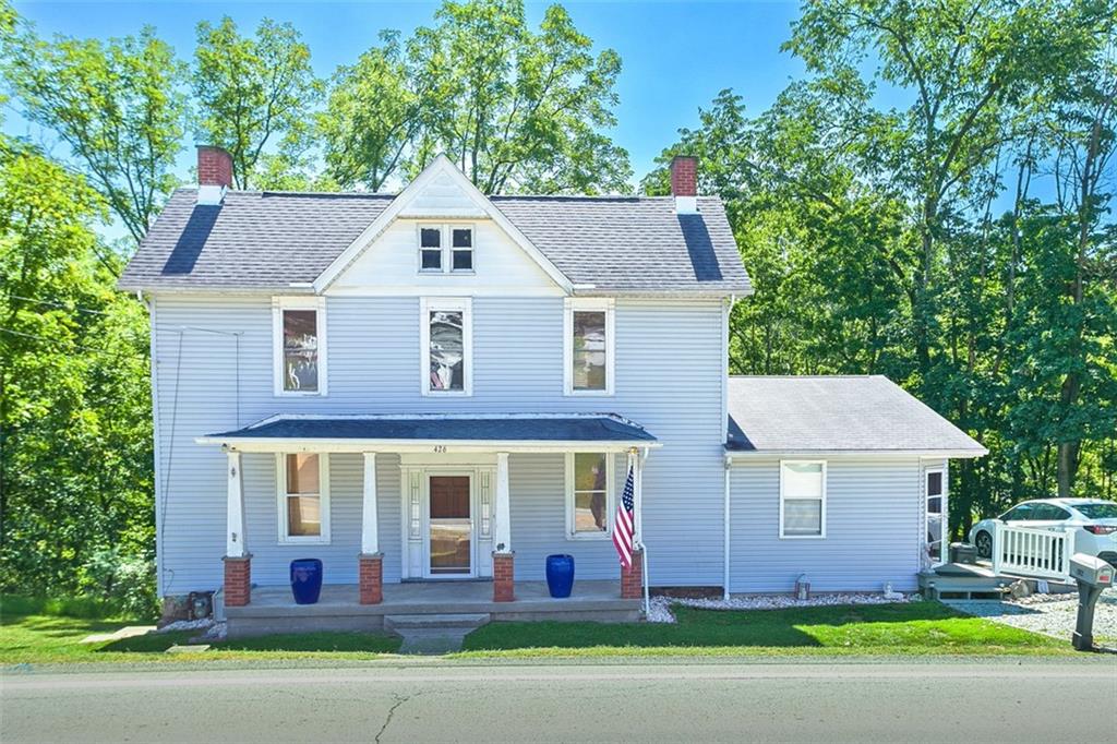 front view of a house with a yard