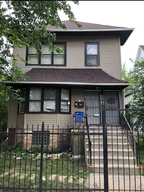 a front view of a house with a porch