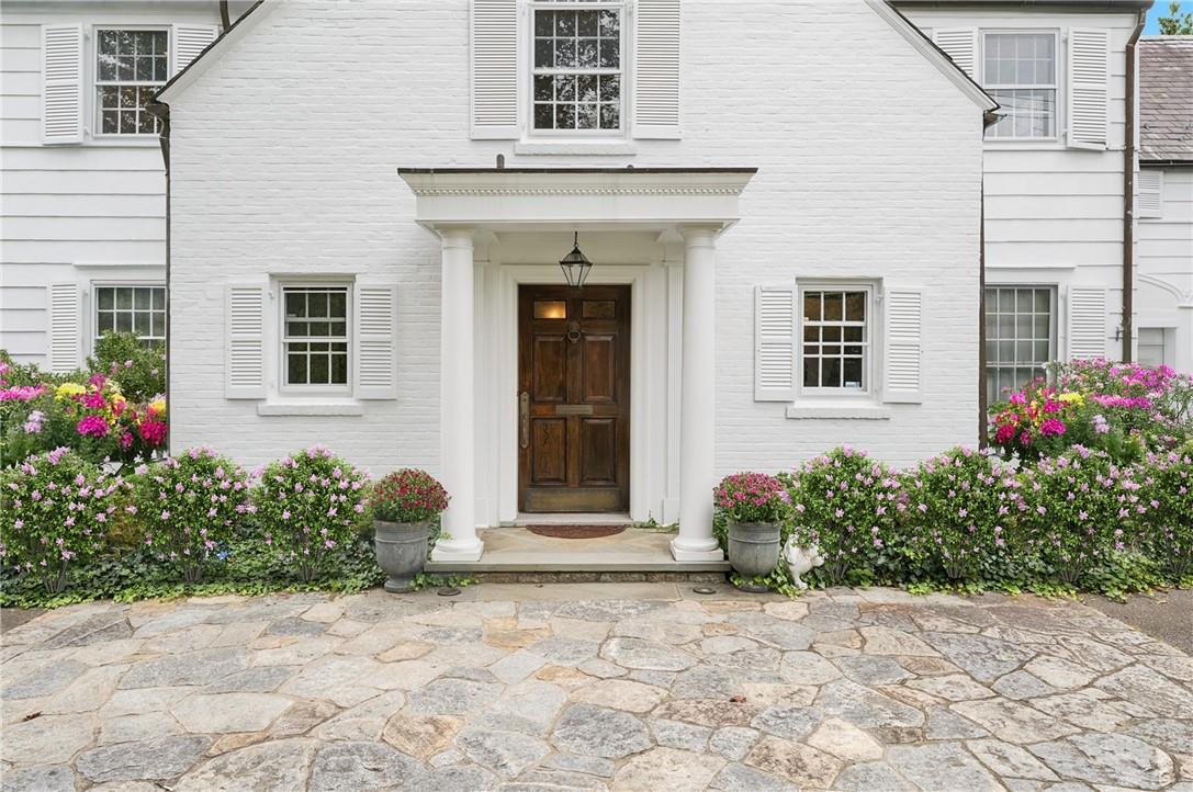 a front view of a house with garden