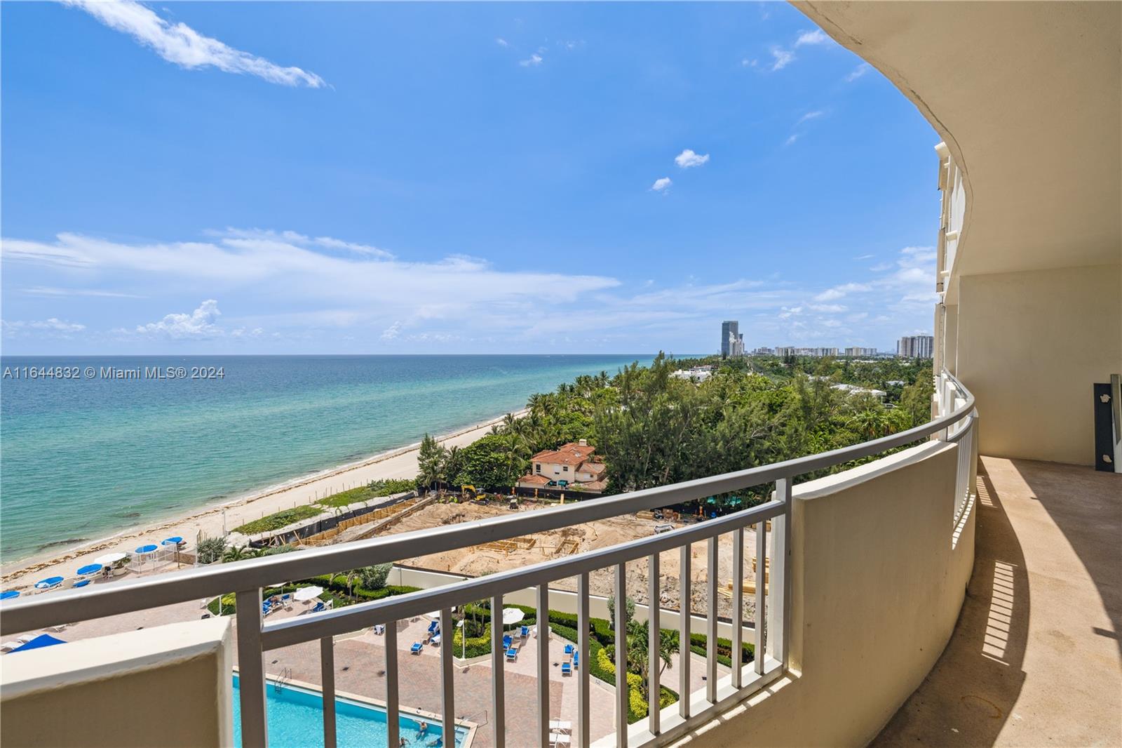 a view of a balcony with an ocean view