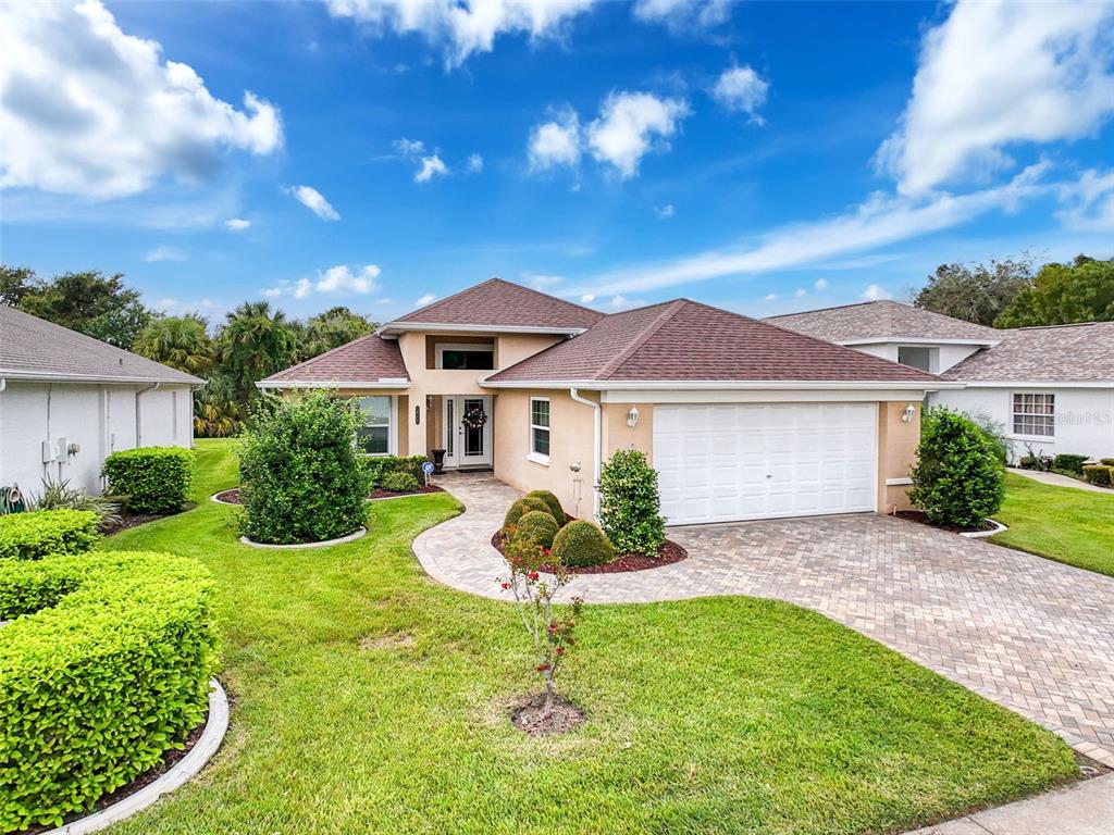 a front view of a house with a yard