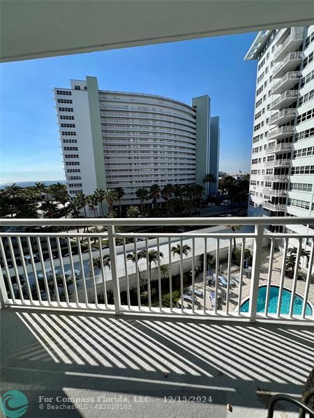 a view of a balcony with a bench