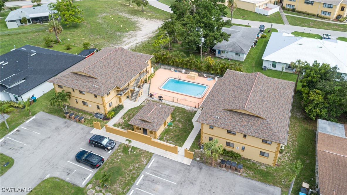 an aerial view of residential house with outdoor space and parking