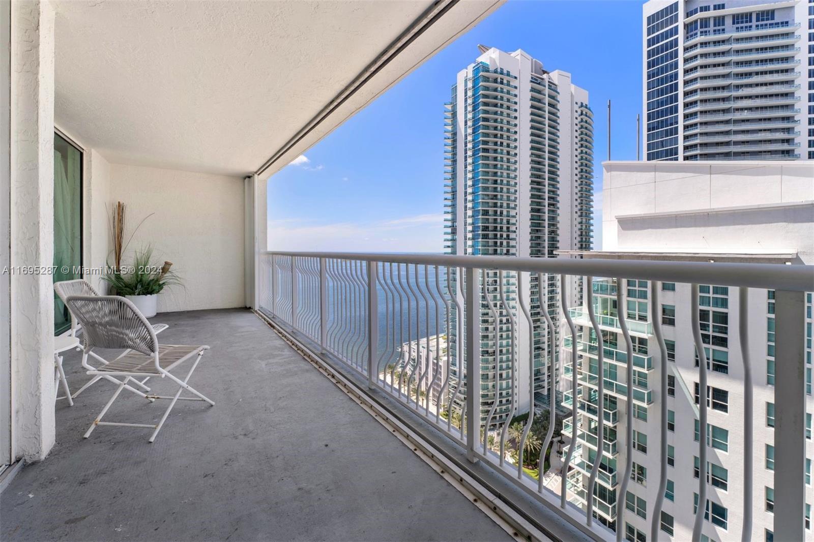 a view of balcony with furniture