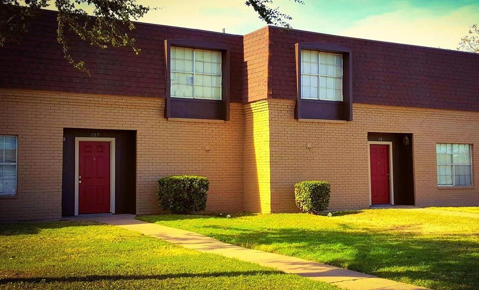 a view of an house with backyard of a house