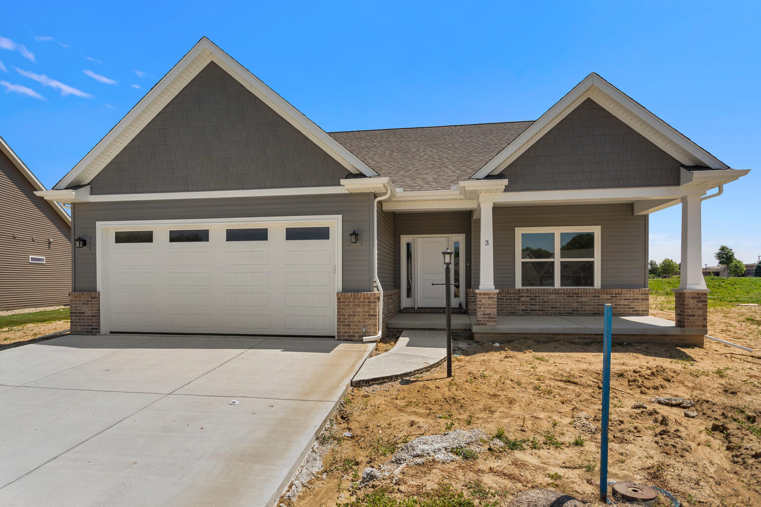 a front view of house with garage