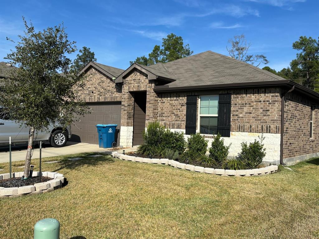 a front view of a house with garden