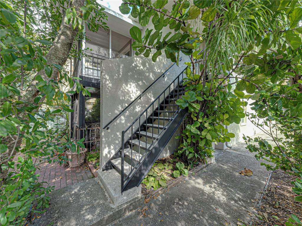 a view of stairs and yard