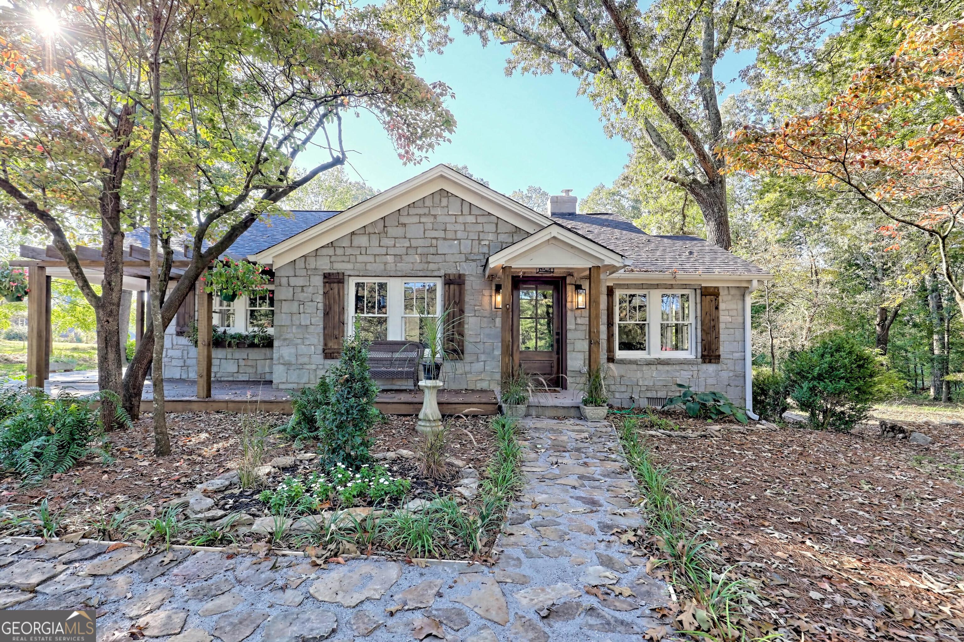 a front view of a house with garden