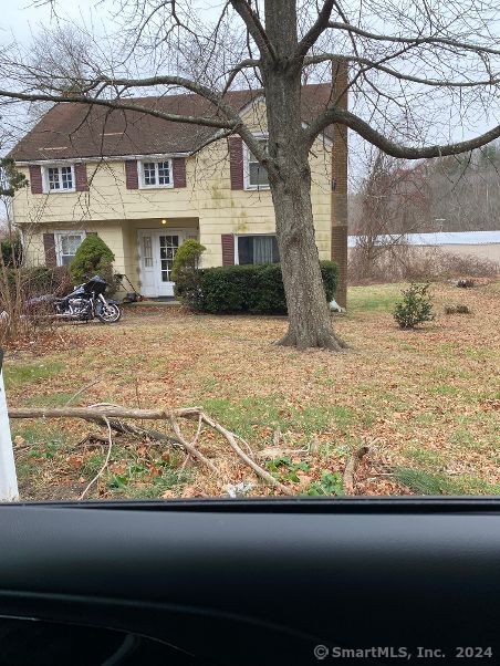 a view of a house with a snow in the yard