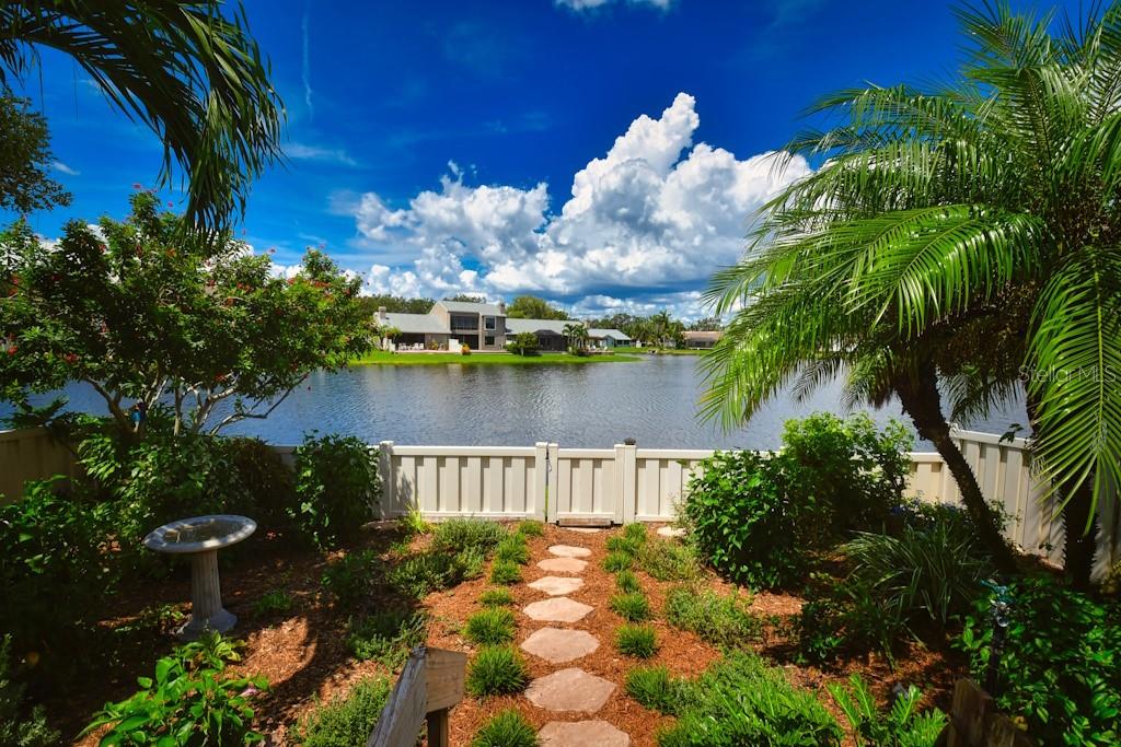 a view of a pond with sitting area