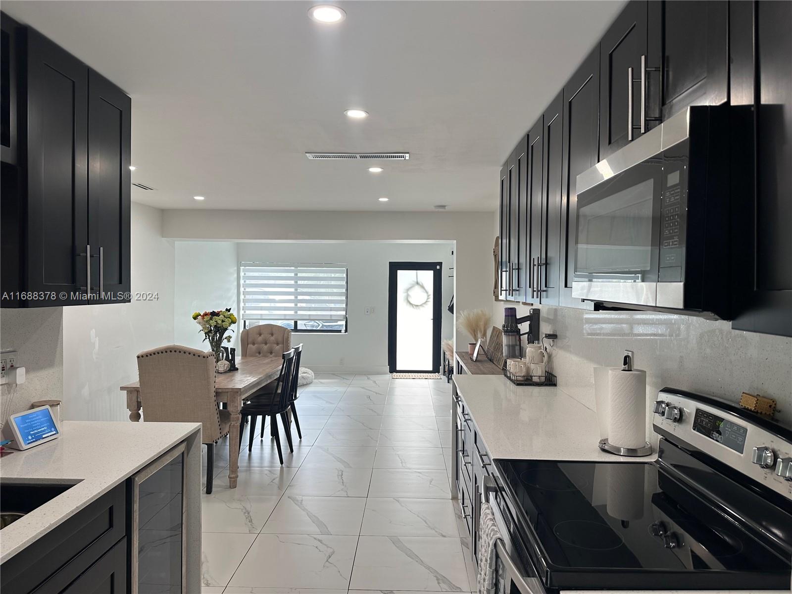 a kitchen with counter space cabinets and appliances