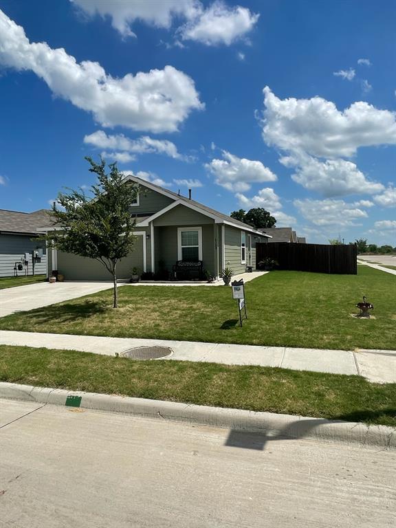 front view of a house with a yard