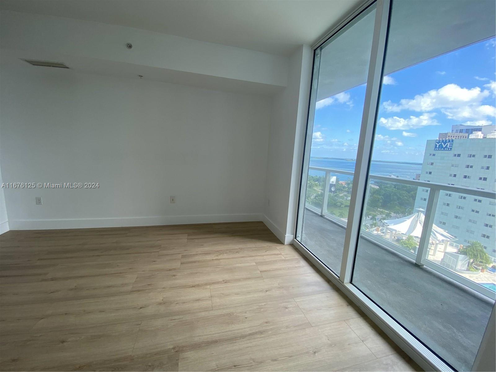 a view of an empty room and window