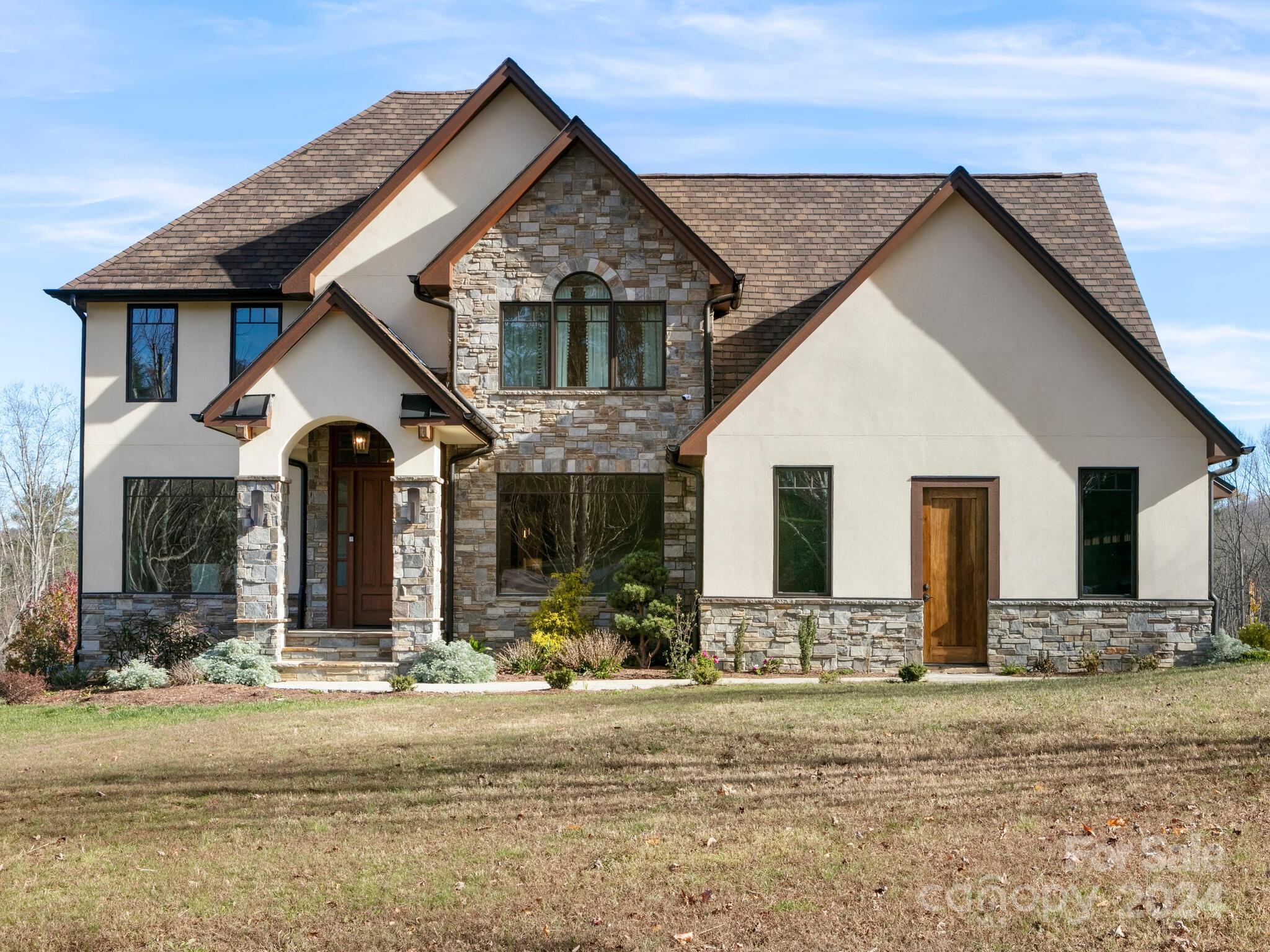 a front view of a house with a yard