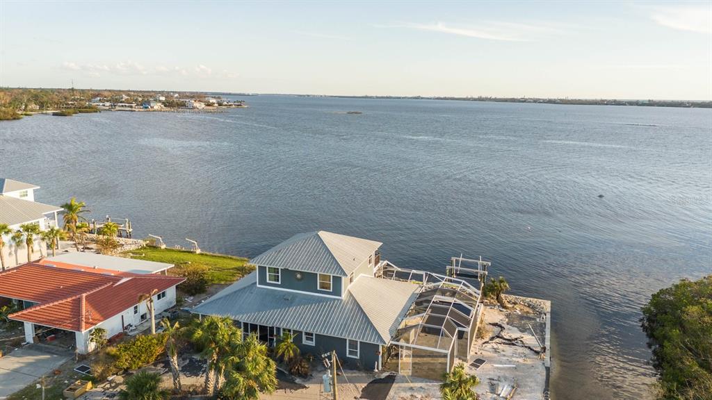 House has unobstructed saltwater views. On a corner lot boasts beautiful southward views of sweet LEMON BAY. Bordered by canal and Lemon Bay Park on the Right. 