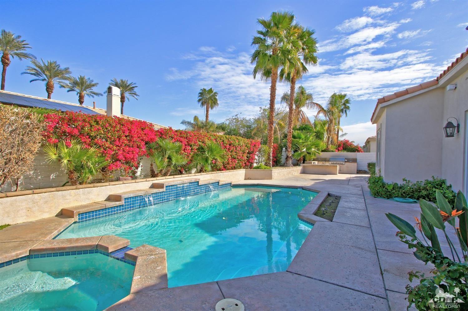 a view of swimming pool with a yard