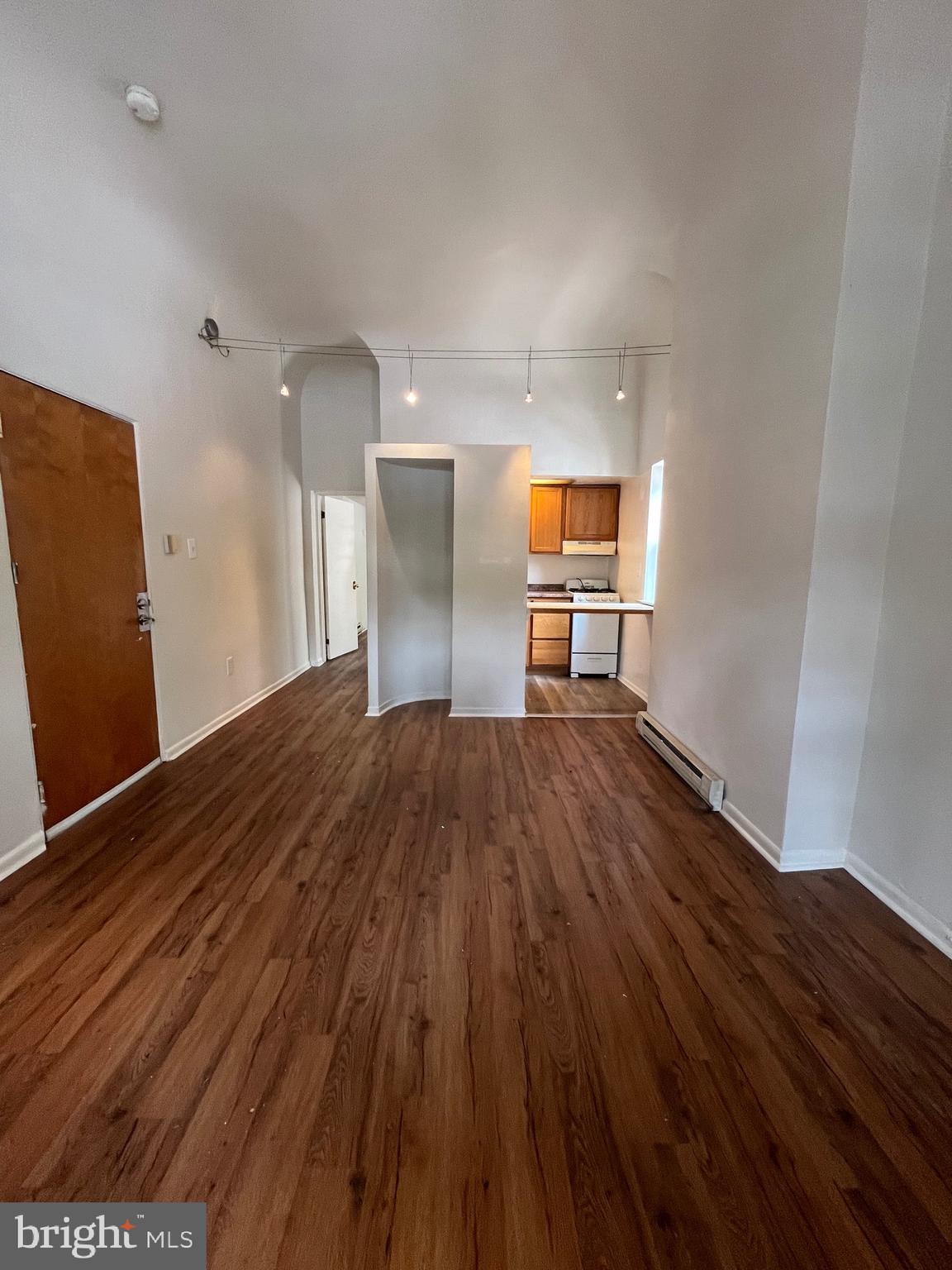 a view of a livingroom with wooden floor