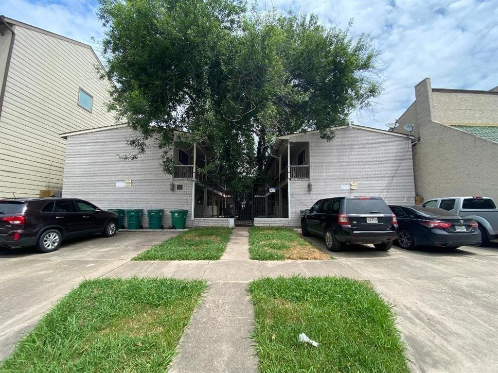 a view of a car parked in front of a house