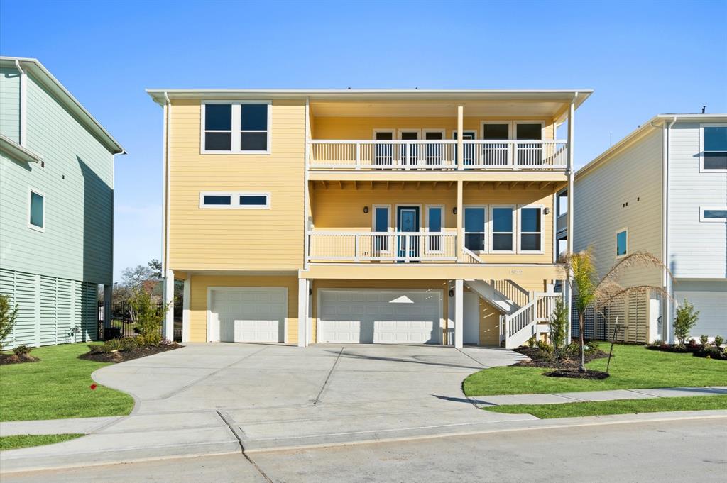 a front view of a building with a yard