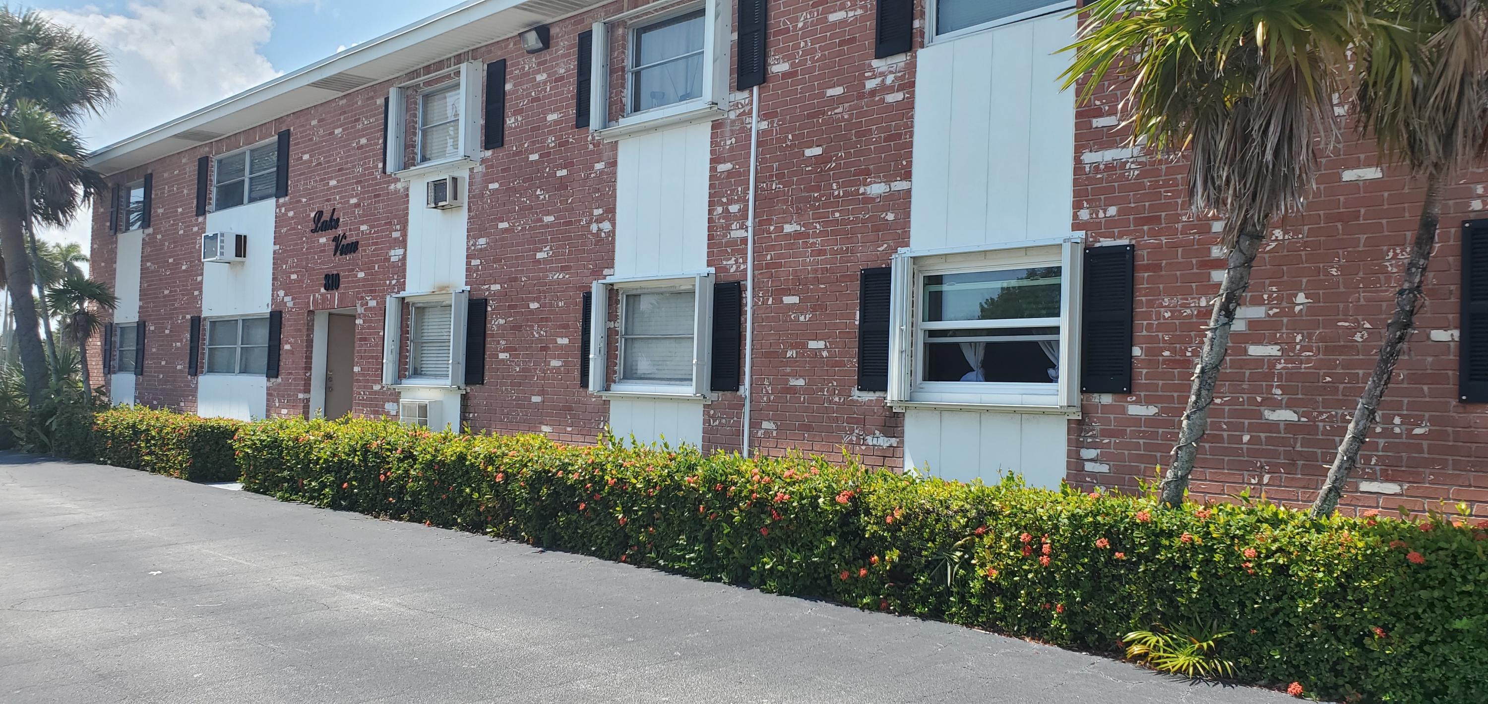 a view of a building with a yard