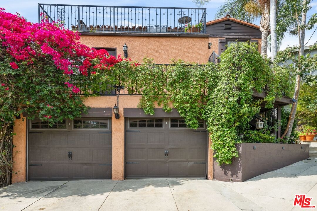 a front view of a house with a garage