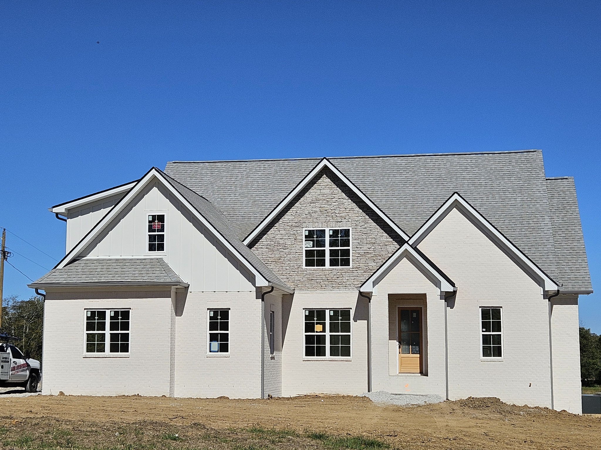 a big house with a large window and more windows