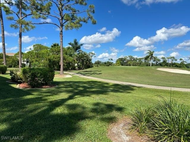 a view of a golf course with a lake