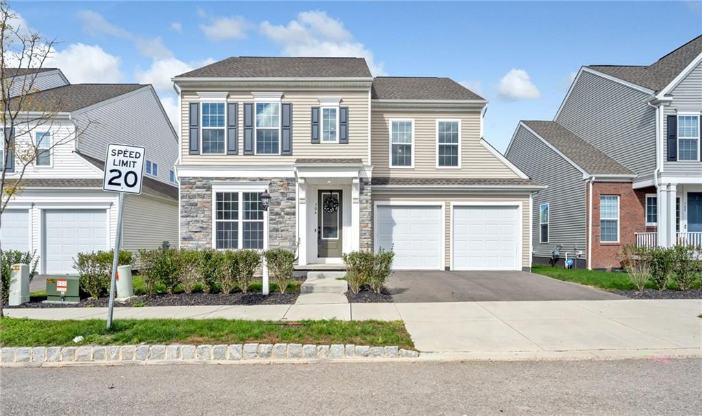 front view of a house with a yard