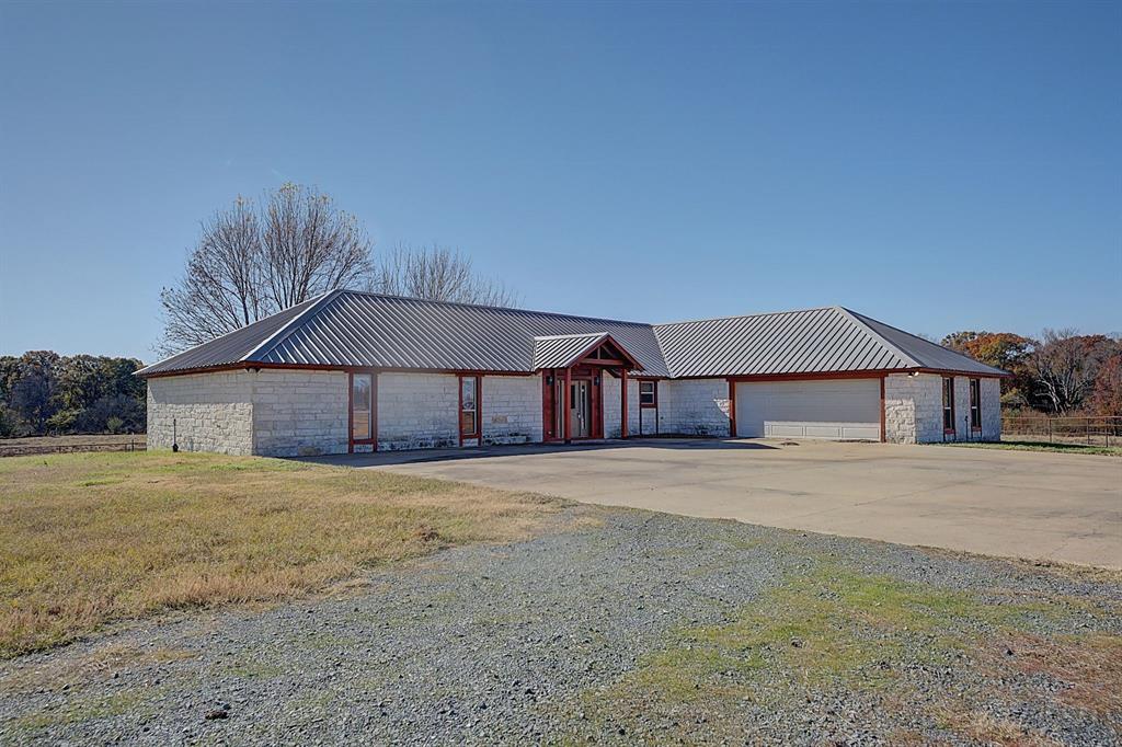 a house with yard and a large space