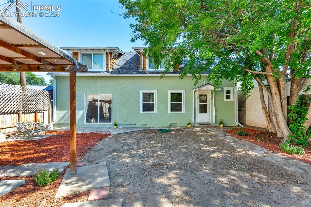 View of front of property with a patio