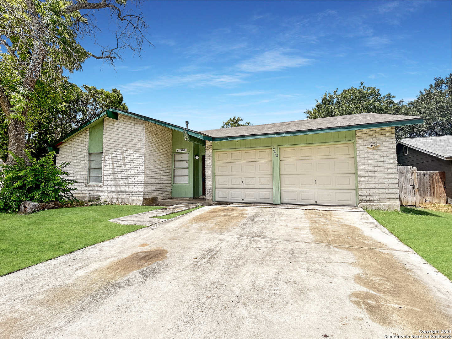 a front view of a house with a garage