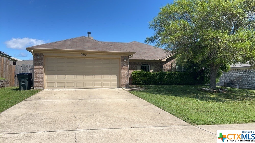 a front view of a house with yard