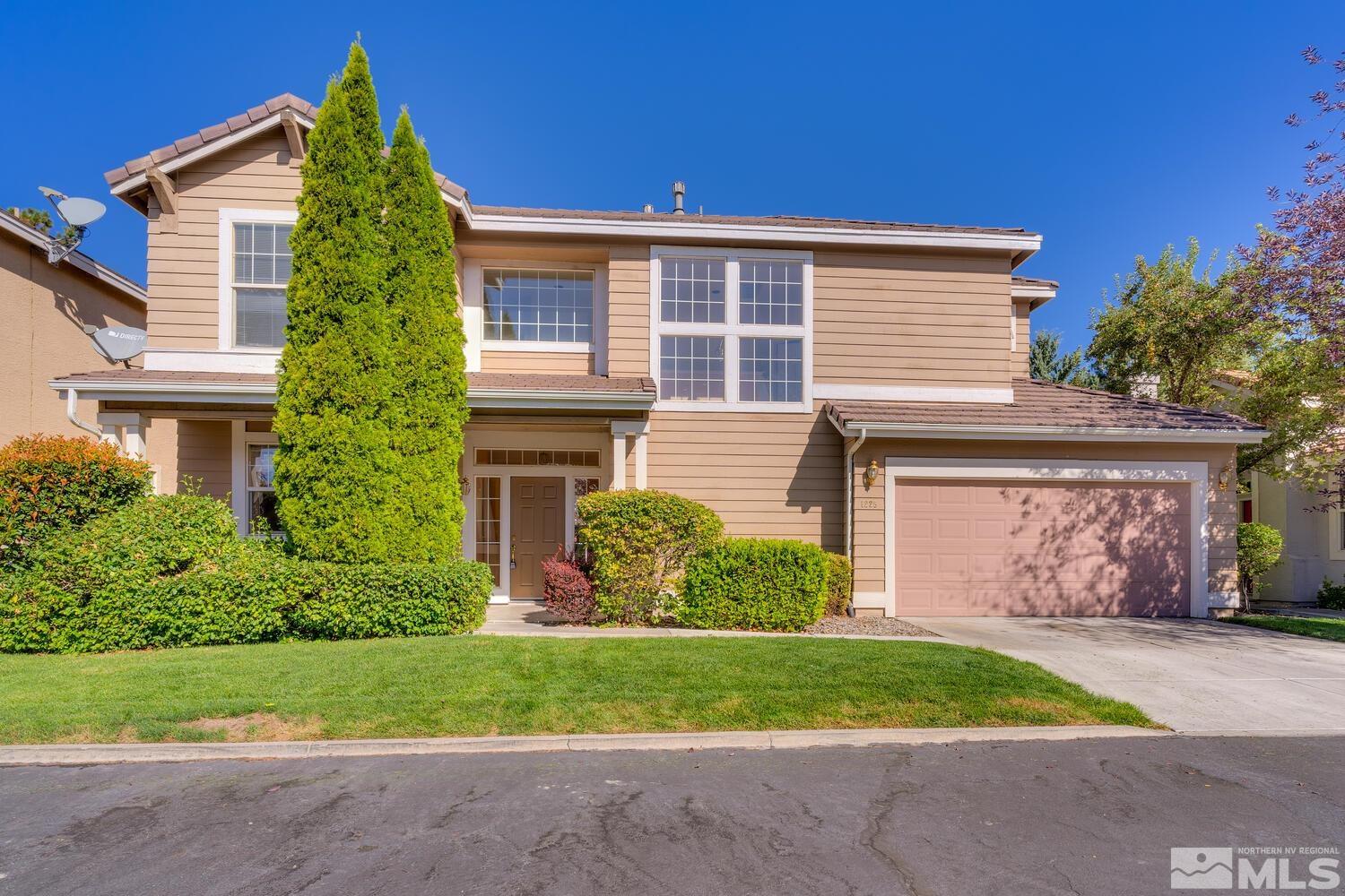 front view of a house with a garden