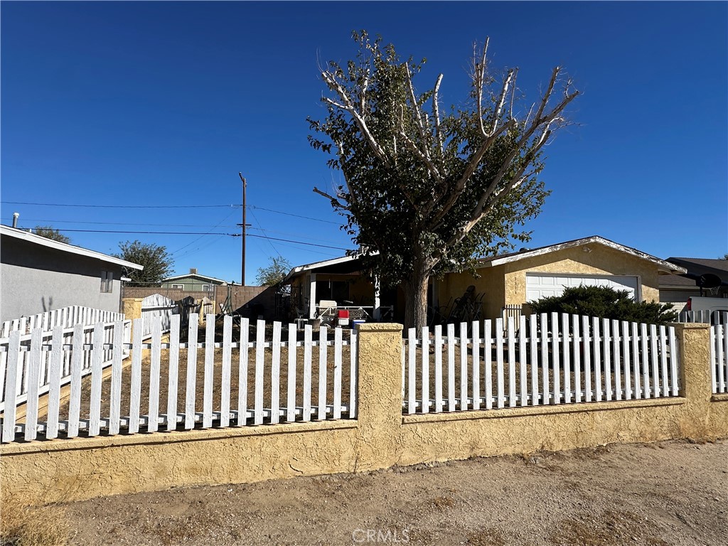 a view of a wrought iron fences in front of house