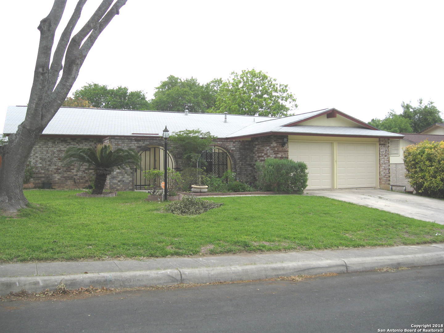 a house view with a garden space