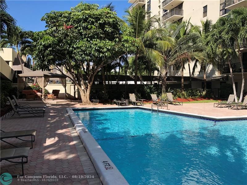 a view of swimming pool with a bench